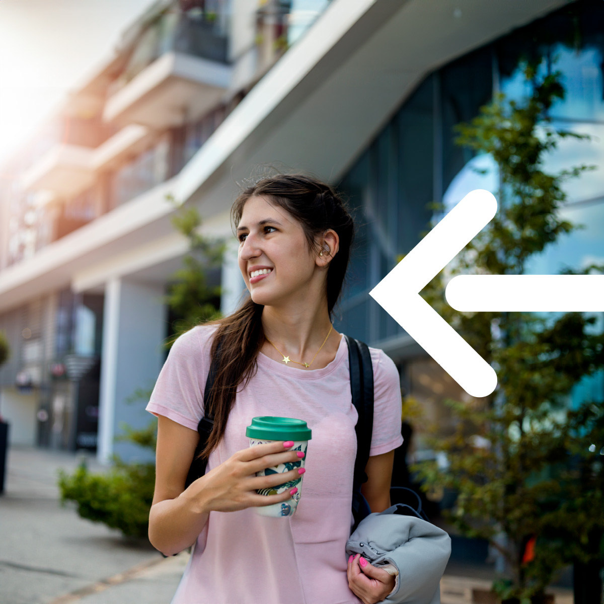 woman with backpack drinking a coffee