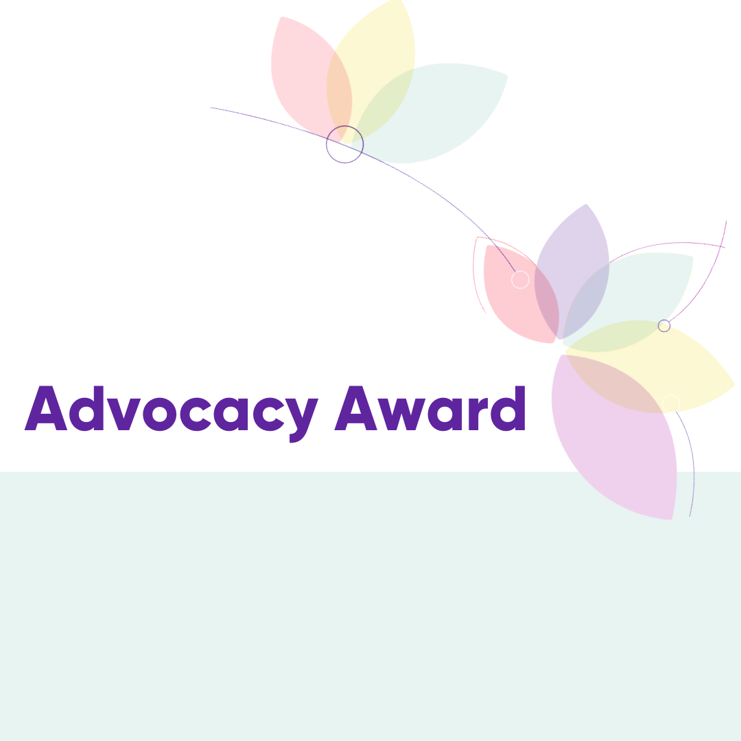 The words, "Advocacy Award" are written in purple on a white and light green background. There are flower petals in the top right corner in light pastel colours.