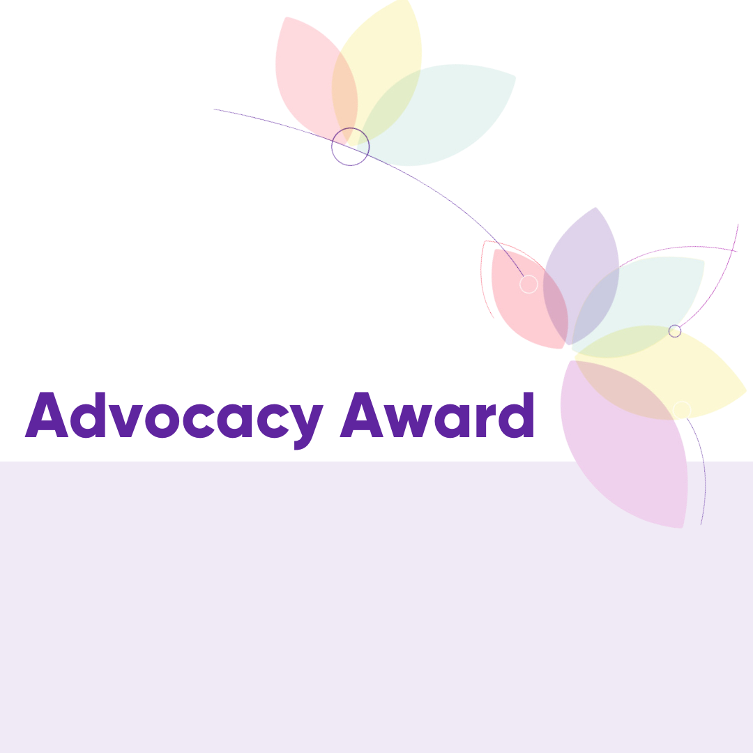 The words, "Advocacy Award" are written in purple on a white and light green background. There are flower petals in the top right corner in light pastel colours.