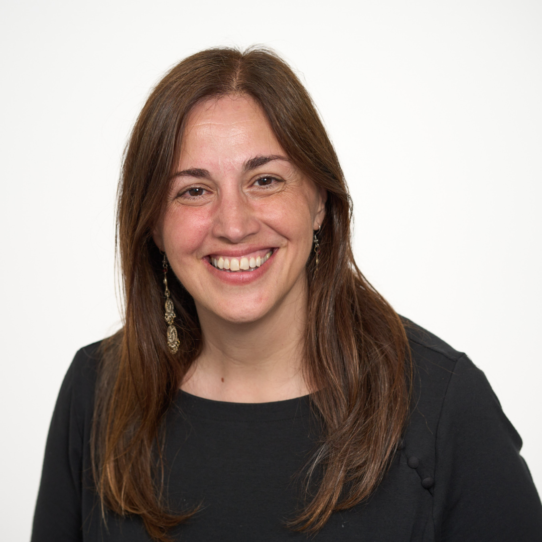 Dr. Evdokia Anagnostou smiles for a headshot in front of a white background.